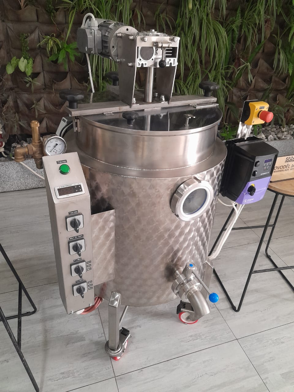 Processing vessel displayed beside the Czech House living wall